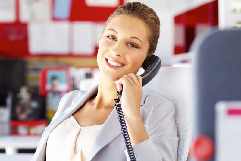 woman on phone using voip phone plan